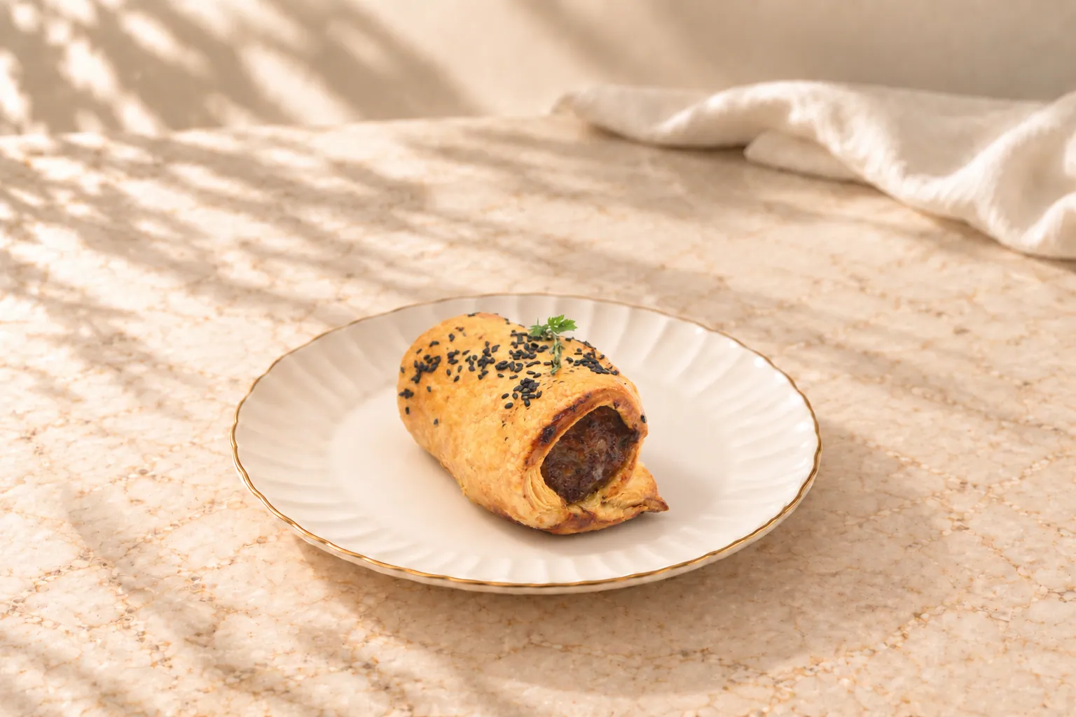Our signature sausage roll on a plate