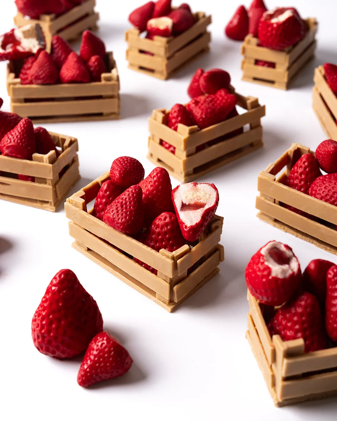 Strawberry pâtisserie in miniature chocolate crates